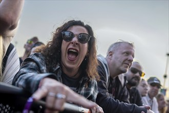 Adenau, Germany, 7 June 2024: Fans listen to Queens of the Stone Age at Rock am Ring. The festival