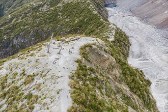 Tourists at the viewing point, hike to crater rim of Chaiten volcano, Park Pumalin, Patagonia,