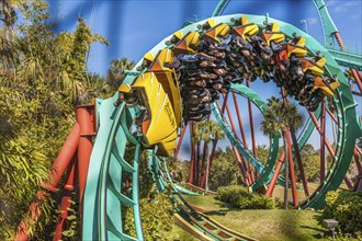 Kumba roller coaster corkscrew seen through safety netting at Busch Gardens in Tampa, Florida, USA,