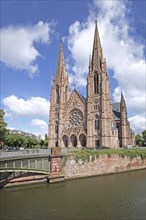 Neo-Gothic St Paul's Church with twin towers and Pont d'Auvergne over the Ill, river, bridge,