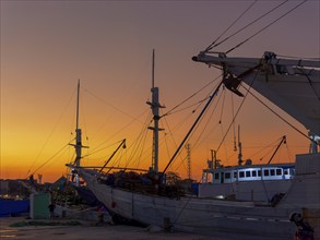 Old wooden ships, schooners and sailing ships, sunset, harbour of Makasar, Sulawesi, Indonesia,