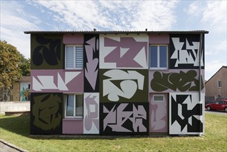 Residential building with mural by street artists Jan Herrmann and Tim Schmeer, façade completely