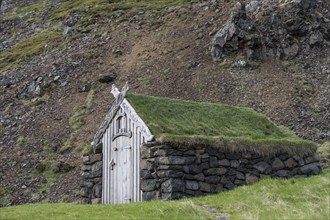 Old hut with stone walls and grass roof, Laugar, Westfjords, Iceland, Europe