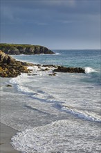 Waves breaking on the rocky coast near Plouarzel on the Atlantic coast, Département Finistère,