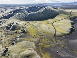 Mountain road F206 along moss-covered Laki crater or Lakagígar, series of craters, aerial view,