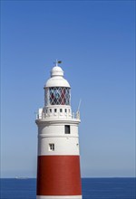 Red and white striped lighthouse at Europa Point, Gibraltar, British territory in southern Spain,