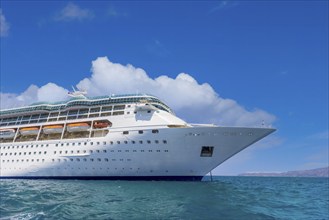 Greece Islands, cruise ship docked near Santorini island on a cruise vacation in Mediterranean