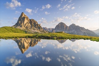 Reflection of the mountains at Passo di Giau, Monte Ragusela, Dolomites, Belluno, Cortina dAmpezzo