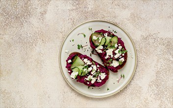 Sandwiches with beetroot hummus, cucumber and blue cheese, microgreens, rye bread, breakfast,