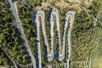 Aerial view, drone shot, Mountain pass road with multiple hairpins, water pipeline, Valais,