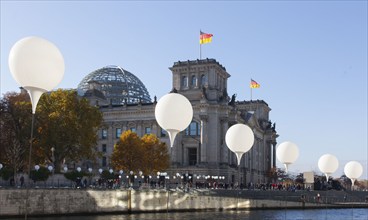 To mark the 25th anniversary of the fall of the Berlin Wall, illuminated balloons symbolise the