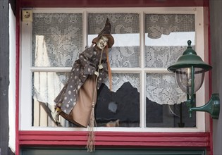 Old Town Goslar, Witch in a window, 06.08.2014., Goslar, Lower Saxony, Germany, Europe