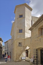 House with corner tower and tourists, mountain village, Les Baux-de-Provence, Alpilles, Alpilles,