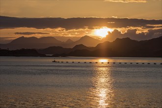 Sunset over the sea south of Mallaig, island, fishing equipment, Scotland, UK