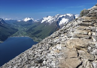 View over the Hjørundfjord on a sunny day in spring, seen from hike up to top of mountain Saksa,