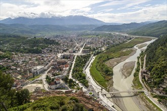 View looking over city centre of Berat in valley of River Osum with mountains beyond, Berat,