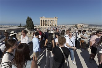 Tourists crowd the viewpoint on the Acropolis, view of Parthenon Temple, Athens, Greece, Europe