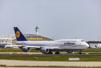 Fraport Airport with Lufthansa aircraft, Boeing 747-8, technical building. Frankfurt am Main,