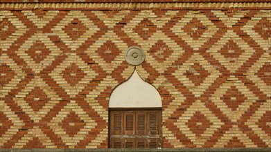 Close-up of a patterned brick wall with geometric design, harbour area, Rhodes Town, Rhodes,