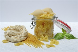 Various types of pasta with glass container, pasta varieties