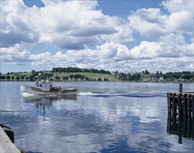 Fishing boat in Lunenburg harbour, Nova Scotia, Canada, North America