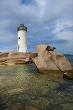 Lighthouse with beach and bizarre granite rocks, Spiaggia Porto Faro, Faro di Punta Palau, Palau,