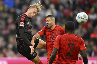 Header duel One-on-one action Raphael Guerreiro FC Bayern Munich FCB (22) vs Benedict Hollerbach 1.