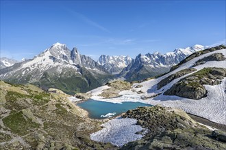 Mountain landscape with mountain lake Lac Blanc, mountain peaks, Aiguille Verte, Grandes Jorasses,