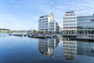 Marina and modern office building on Lake Phoenix in Dortmund, North Rhine-Westphalia, Germany,