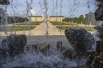 View through the Neptune Fountain to Schönbrunn Park and Palace, UNESCO World Heritage Site in