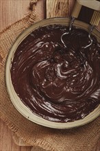 A bowl of chocolate dough, a whisk for a mixer, baking, structure and consistency, homemade, top