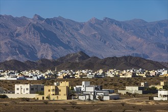 The new settlement of Jabrin, view from the palace fortress of Jabrin, behind the mountains of