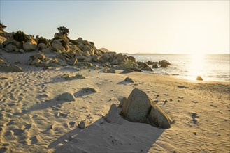 Lonely beach and rocks, sunrise, Spiaggia di Porto Giunco, Villasimius, south coast, Sardinia,