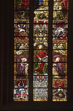 Colourful stained glass window by Alexander Linnemann 1901 with patron saint St. Cecilia for church