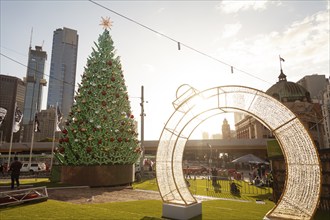 December 2019 CBD Melbourne in Australia shortly in front of Christmas. Low sun illuminates the