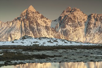 Rugged mountains, Lofoten island Vestvågøya at the fjord Gimsøystraumen, Lofoten, Northern Norway,