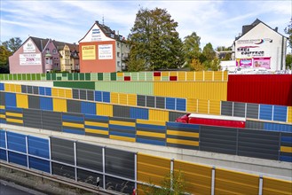 Colourful noise barriers on the A52 motorway, at the Essen-Rüttenscheid junction, the noise