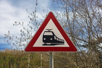 Traffic sign 151, railway crossing announcement, red triangle with train symbol, sign, danger sign,