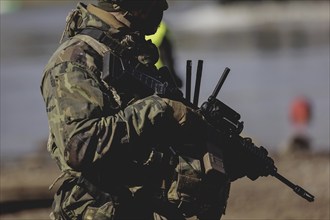 A soldier with a rifle, taken during the military exercise 'Wettiner Schwert' with German and Czech