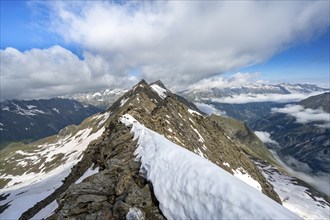 Rocky summit with snow, summit of the Schönbichler Horn, Berliner Höhenweg, Zillertal Alps, Tyrol,