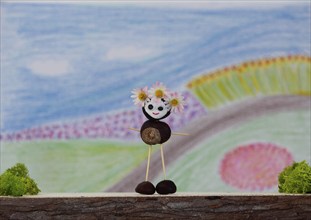 Chestnut figure in front of a painted background, North Rhine-Westphalia, Germany, Europe