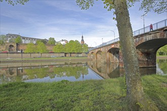 Old bridge built in 1549 over the Saar with castle, castle church and historic city fortifications,