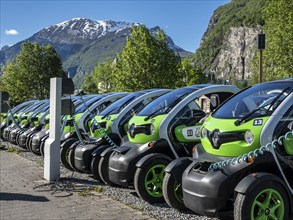 Electric powered Renault Twizy rental cars charging up at Geiranger, Norway, Europe