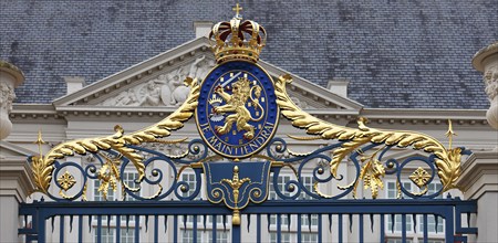 Coat of arms with the Dutch motto Je Maintiendrai, above the entrance to the Royal Palace