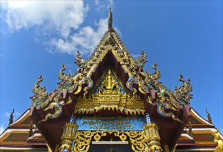 Decorated pediment of the ordination hall, also Bot, of the temple Wat Plai Laem with