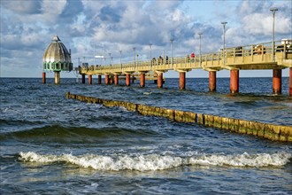 Diving gondola at the Zingst pier, cloudy mood and waves, Baltic Sea coast, Zingst,