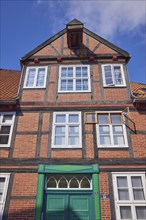 Old half-timbered house with the device for holding a pulley block in Stade, Hanseatic city,