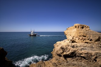 Excursion boat, sailing ship, tour with tourists, boat tour, coloured rocks and grottos, shell