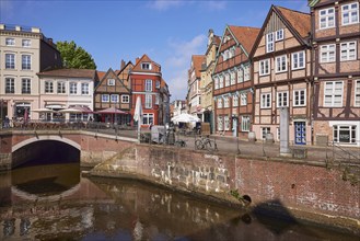 Hudebrücke, a brick barrel-vaulted bridge, historic half-timbered houses and the river Schwinge in