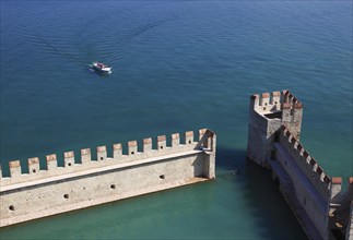 Harbour basin of the castle with flat Guelph battlements, Scaliger Castle, Castello Scaligero, in